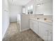 Clean, well-lit bathroom featuring double sinks, a large mirror, and a shower/tub combo at 10827 Azure Valley Pl, Charlotte, NC 28269