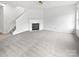 Spacious living room with neutral carpet, fireplace, and plenty of natural light at 10827 Azure Valley Pl, Charlotte, NC 28269