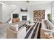 Bright living room with fireplace, sofa, and stylish decor for a cozy atmosphere at 10827 Azure Valley Pl, Charlotte, NC 28269