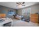Neutral bedroom with ceiling fan, natural light, and room for work and relaxation at 1100 22Nd Ne St # 502, Hickory, NC 28601