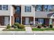 Inviting townhouse facade with brick accents, complemented by lush greenery, enhancing curb appeal at 1100 22Nd Ne St # 502, Hickory, NC 28601