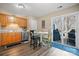 Cozy eat-in kitchen with warm cabinets, a charming round table, and access to outdoor deck at 1100 22Nd Ne St # 502, Hickory, NC 28601