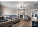 Comfortable living room with fireplace, ceiling fan, and hardwood floors, creating a warm ambiance at 1100 22Nd Ne St # 502, Hickory, NC 28601