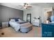 Comfortable main bedroom with ceiling fan, neutral tones, and ample natural light at 1100 22Nd Ne St # 502, Hickory, NC 28601