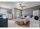 Comfortable main bedroom with ceiling fan, neutral tones, and ample natural light at 1100 22Nd Ne St # 502, Hickory, NC 28601