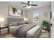 Serene bedroom with neutral tones, large window, and plush bedding offers a relaxing retreat at 111 Proust Rd, Statesville, NC 28625
