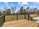 Wooden deck with railing overlooking the backyard at 111 Proust Rd, Statesville, NC 28625