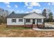 Charming single-story home with a welcoming front porch and well-maintained lawn at 111 Proust Rd, Statesville, NC 28625