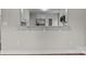 Modern kitchen with white cabinets, stainless steel appliances, and a breakfast bar at 111 Proust Rd, Statesville, NC 28625