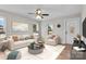 Bright living room featuring contemporary furnishings, neutral tones, and ample natural light at 111 Proust Rd, Statesville, NC 28625