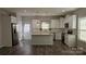 Modern kitchen features white cabinets, stainless steel appliances, and a functional center island at 1124 Clouse St, Gastonia, NC 28052