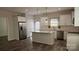 Bright kitchen with a center island, stainless steel appliances, and elegant white cabinetry at 1124 Clouse St, Gastonia, NC 28052
