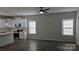 Open living room view of kitchen featuring stainless appliances and wood grain flooring at 1124 Clouse St, Gastonia, NC 28052