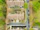 Aerial view showing property lines of townhomes with green spaces and trees in a neighborhood setting at 11308 Morgan Valley Ln, Charlotte, NC 28270