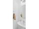 Simple half bathroom featuring a sink, mirror, and towel rack at 11308 Morgan Valley Ln, Charlotte, NC 28270