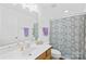 Well-maintained bathroom featuring a vanity with countertop, sink, and shower-tub combo at 11308 Morgan Valley Ln, Charlotte, NC 28270