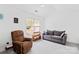 Bright bedroom boasts a vaulted ceiling, neutral carpet, and a cozy couch and armchair for a relaxing atmosphere at 11308 Morgan Valley Ln, Charlotte, NC 28270