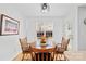 Cozy dining area featuring a wood table, chairs, and natural light at 11308 Morgan Valley Ln, Charlotte, NC 28270