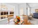Bright dining nook with wood table set, natural light, and view to the backyard at 11308 Morgan Valley Ln, Charlotte, NC 28270