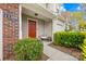 Inviting front entrance with a charming porch, lush greenery, and well-maintained landscaping at 11308 Morgan Valley Ln, Charlotte, NC 28270