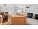 Open-concept living space with kitchen island, fireplace, and comfortable seating at 11308 Morgan Valley Ln, Charlotte, NC 28270
