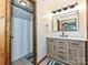 A stylish bathroom featuring a modern vanity, elegant fixtures, and a shower with a curtain at 119 Dills Dr, Dallas, NC 28034
