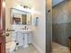 This renovated bathroom features a pedestal sink, hexagonal tile floors, and a walk-in shower at 119 Dills Dr, Dallas, NC 28034