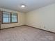 Cozy bedroom with neutral carpet and natural light filtering through the window at 119 Dills Dr, Dallas, NC 28034