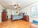 A relaxing bedroom features hardwood floors, neutral walls, and natural light at 119 Dills Dr, Dallas, NC 28034