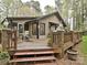 Wooden deck with comfortable seating and lush landscaping, perfect for outdoor living at 119 Dills Dr, Dallas, NC 28034