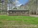 Ranch style home with a covered front porch, brick accents, and a well-manicured lawn at 119 Dills Dr, Dallas, NC 28034