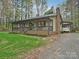 Charming home with a covered front porch, brick accents, and a well-maintained lawn at 119 Dills Dr, Dallas, NC 28034
