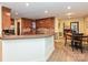 Well-appointed kitchen featuring wood cabinets and a breakfast bar, open to the adjacent eating area at 119 Dills Dr, Dallas, NC 28034