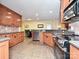 Bright kitchen with wood cabinets, stainless steel appliances, and a tile backsplash at 119 Dills Dr, Dallas, NC 28034