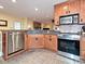Open-concept kitchen with stainless steel appliances and a breakfast bar overlooking the living area at 119 Dills Dr, Dallas, NC 28034