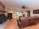 Comfortable living room showcasing a stone fireplace and views into the entry at 119 Dills Dr, Dallas, NC 28034