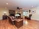 Cozy living room with a stone fireplace, hardwood floors, and ample natural light at 119 Dills Dr, Dallas, NC 28034