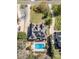 Aerial view displays a roof with solar panels, lush backyard, in-ground pool, and lengthy driveway at 124 Cedar Woods Dr, Mooresville, NC 28117