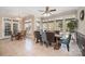 Bright dining room with natural light, tile floors, a ceiling fan, and large table at 124 Cedar Woods Dr, Mooresville, NC 28117