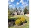 Landscaped front yard and beautiful lawn leading up to this lovely home at 124 Cedar Woods Dr, Mooresville, NC 28117