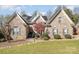 Well-maintained brick home with updated features and neatly landscaped front yard at 124 Cedar Woods Dr, Mooresville, NC 28117