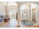 Welcoming foyer featuring tile flooring, an arched doorway, and a decorative front door at 124 Cedar Woods Dr, Mooresville, NC 28117