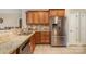 Well-lit kitchen featuring stainless steel appliances and granite countertops at 124 Cedar Woods Dr, Mooresville, NC 28117