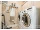 Convenient laundry room with modern appliances including a washer and dryer set at 124 Cedar Woods Dr, Mooresville, NC 28117
