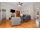 Comfortable living room with hardwood floors, a fireplace, and large windows at 124 Cedar Woods Dr, Mooresville, NC 28117
