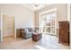 Bright living room with a large window, a loveseat, and a wooden chest at 124 Cedar Woods Dr, Mooresville, NC 28117