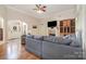 Spacious living room with hardwood floors, fireplace, and ample seating at 124 Cedar Woods Dr, Mooresville, NC 28117