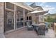 Outdoor patio with a dining table, chairs, and a view of the screened in porch at 124 Cedar Woods Dr, Mooresville, NC 28117