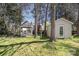 Backyard with gazebo, storage shed, grass and lots of shade trees at 14525 Arbor Ridge Dr, Charlotte, NC 28273
