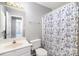 Bright bathroom with blue and white shower curtain at 14525 Arbor Ridge Dr, Charlotte, NC 28273